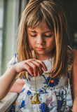 GOLD SAILBOAT CHARM NECKLACE