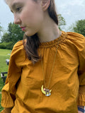GLOW-IN-THE-DARK SLEEPY SLOTH NECKLACE